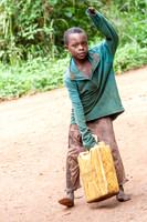 Village Boy Carries Water