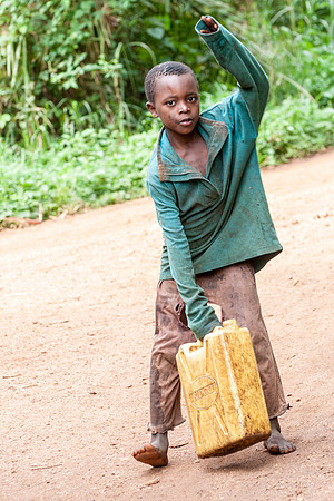 Village Boy Carries Water